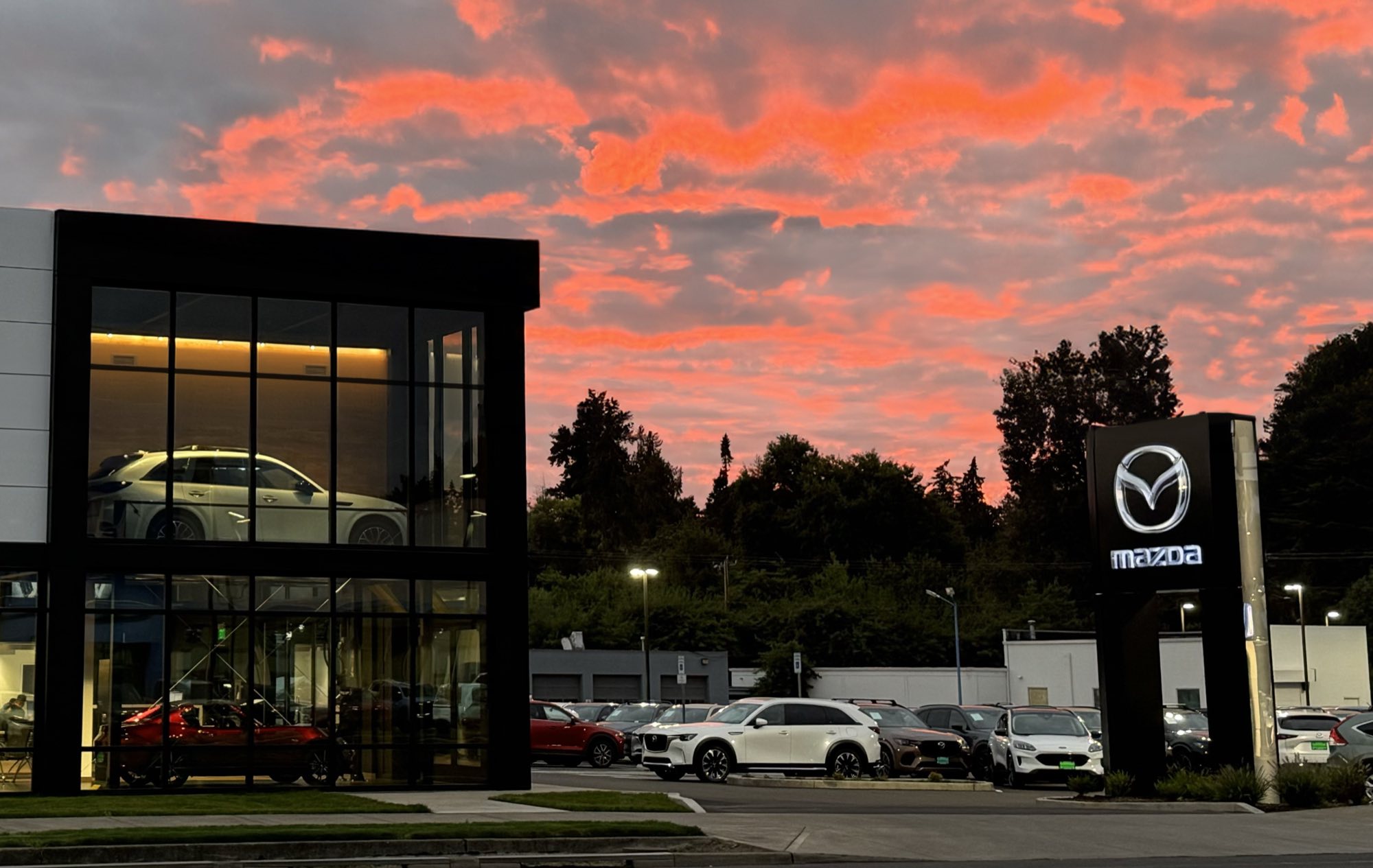 Mazda of Gladstone dealership at sunset